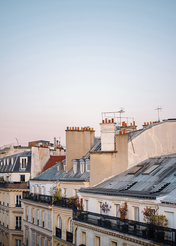 Tableau de villes avec toits au lever du jour