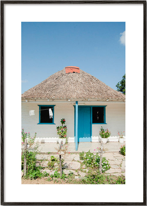Tableau paysager: maison à porte bleue