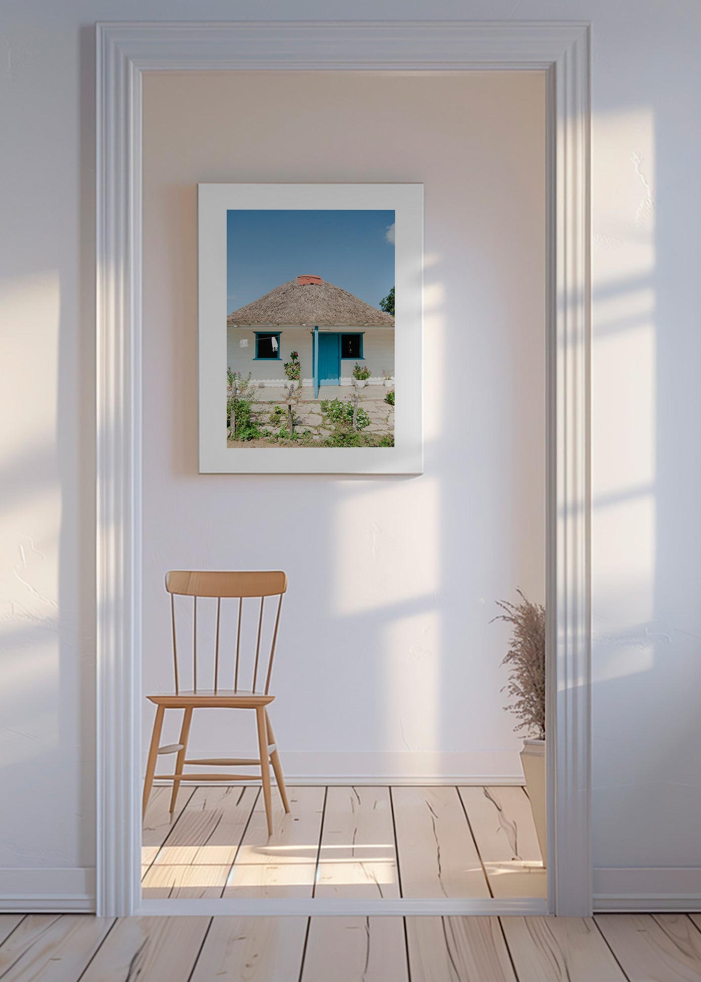 Tableau paysager: maison à porte bleue