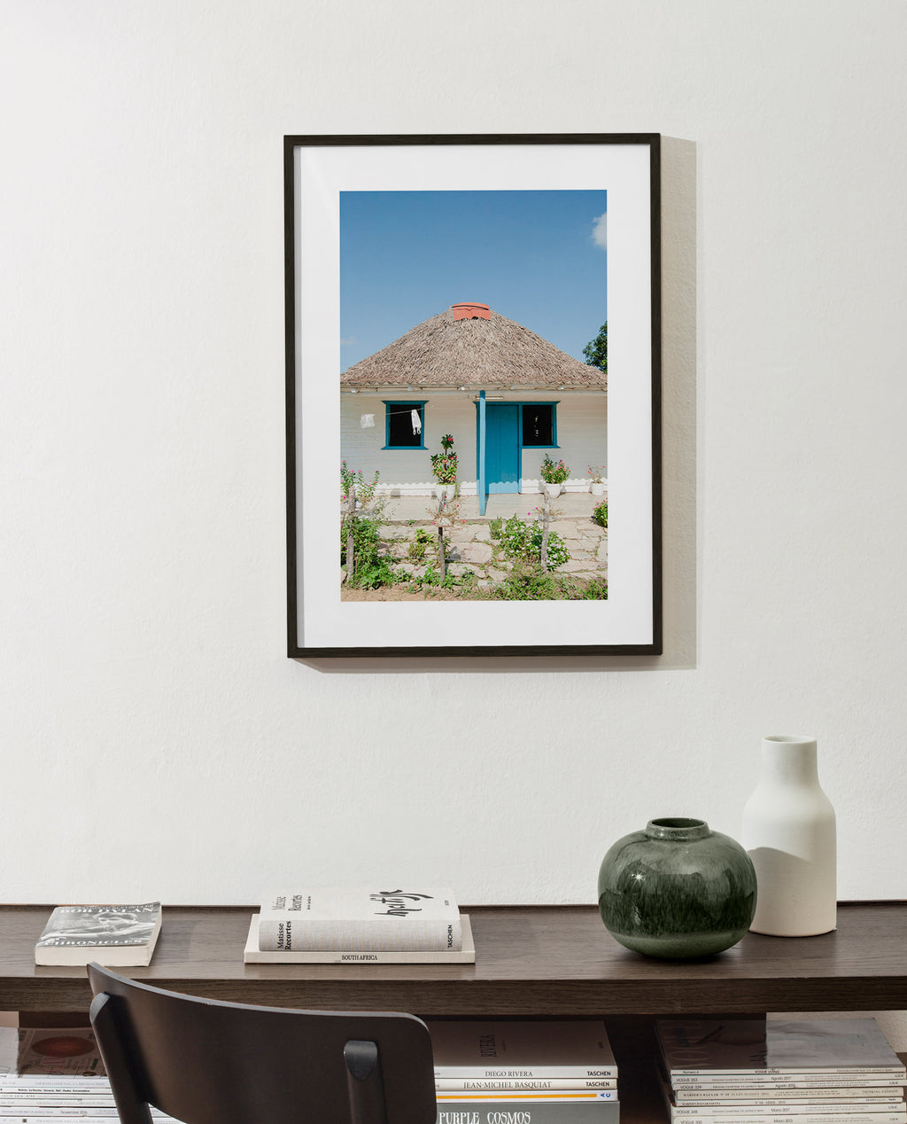Tableau paysager: maison à porte bleue
