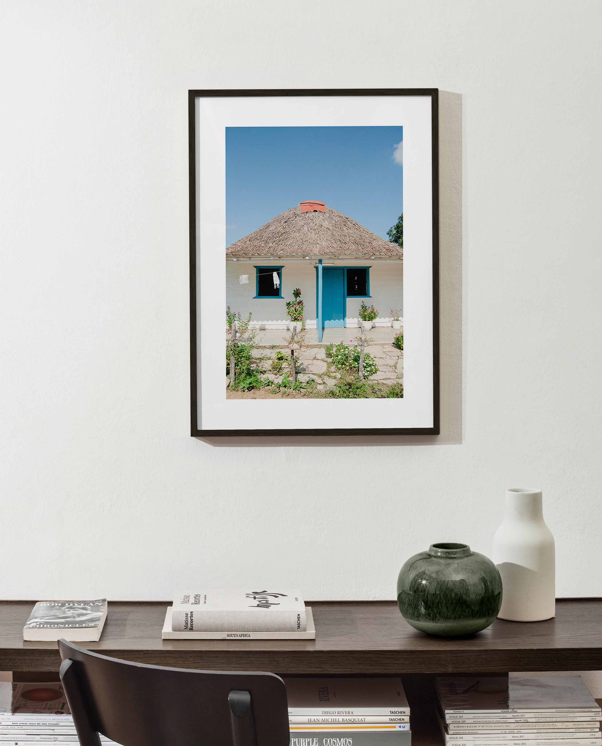 Tableau paysager: maison à porte bleue