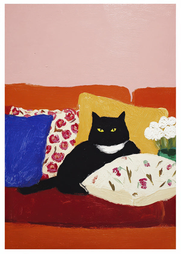 Œuvre chat noir sur canapé coloré