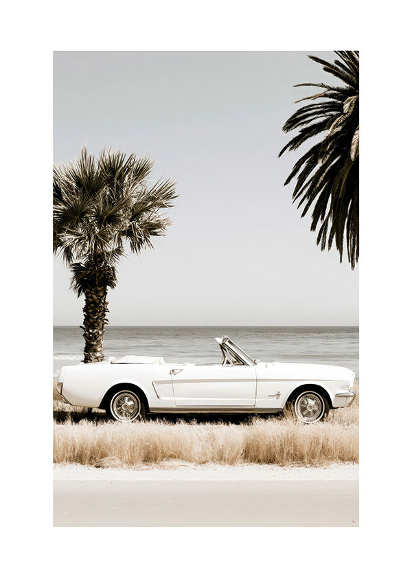 Photographie voiture vintage au bord de la mer